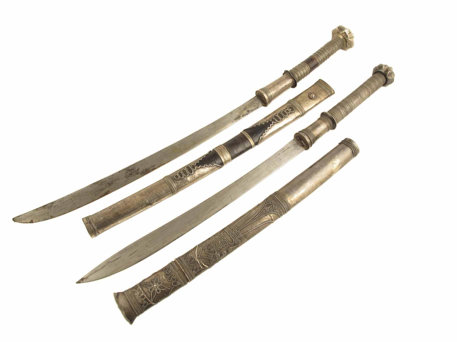 Appraisal: Two Indo-Persian white metal mounted swords