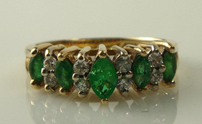 Appraisal: K YG diamond and emerald ring marquis cut diamonds about