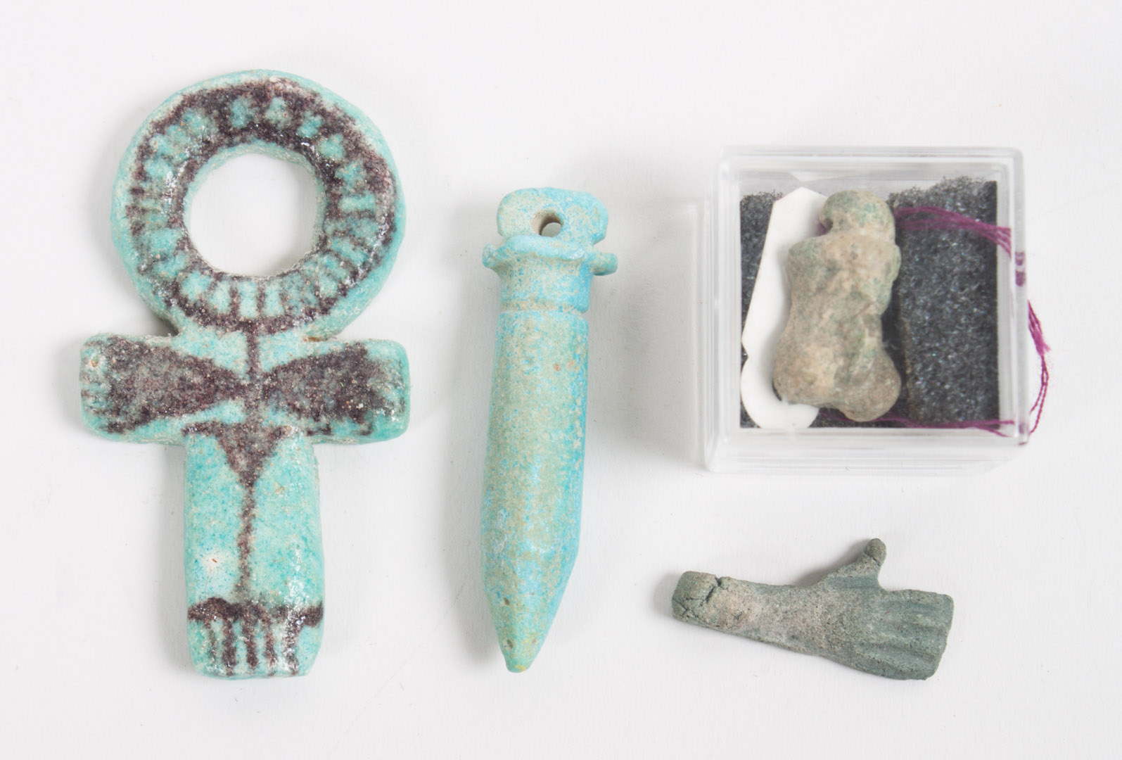 Appraisal: Four ancient Egyptian faience amulets comprising an ankh with painted