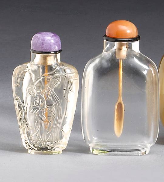 Appraisal: Two glass snuff bottles The first of rounded rectangular transparent