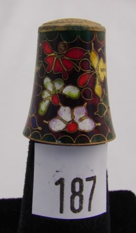 Appraisal: Cloisonne style thimble with multi colored floral design