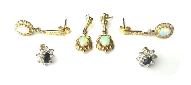 Appraisal: A pair of gold opal and diamond set pendant cluster