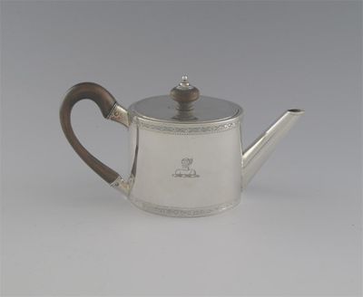 Appraisal: A George III saffron teapot of drum form with a