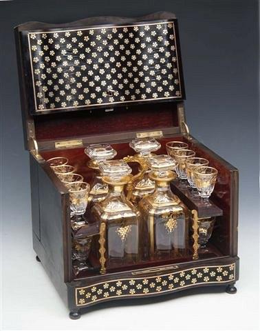 Appraisal: A FRENCH GLASS LIQUEUR SET consisting of four decanters and