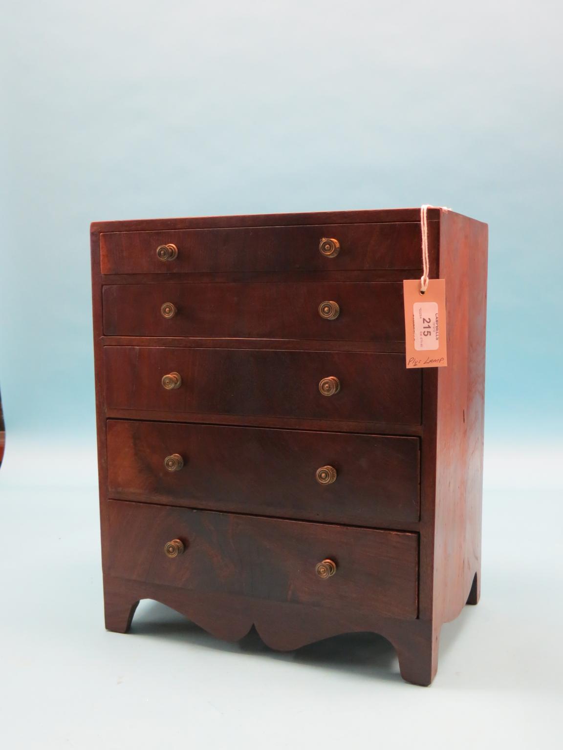 Appraisal: An early th century miniature mahogany chest five graduated drawers