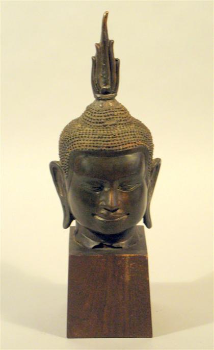 Appraisal: Thai bronze Buddha head th th century With serene facial