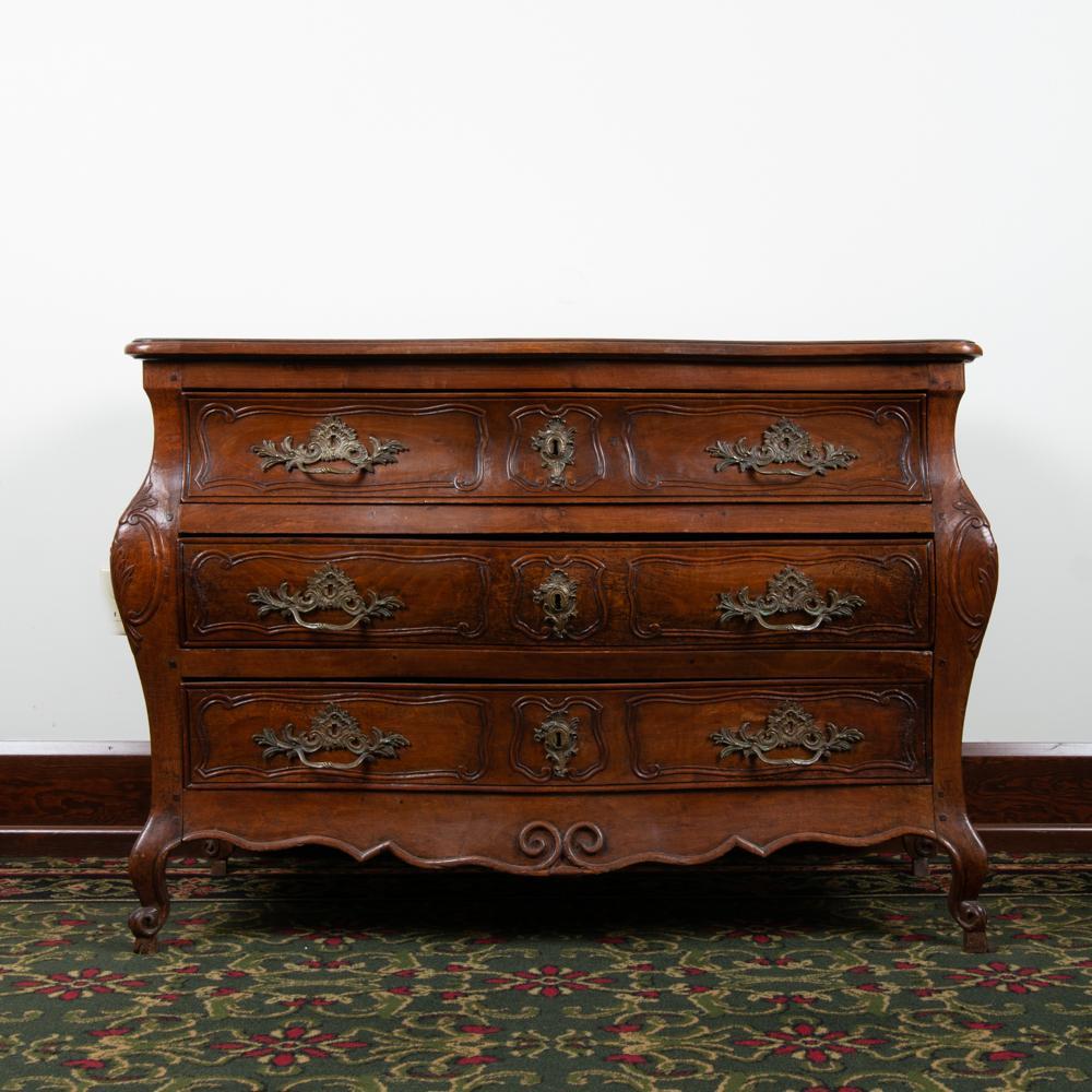 Appraisal: TH C FRENCH BOMBE COMMODE Fruitwood mortise-and-tenon and dowel construction