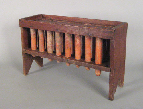 Appraisal: Pennsylvania pine candlemold early th c with sixteen redware tubes