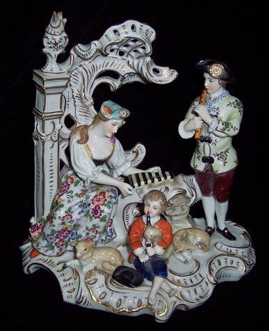 Appraisal: A German porcelain figure group of three musicians on a