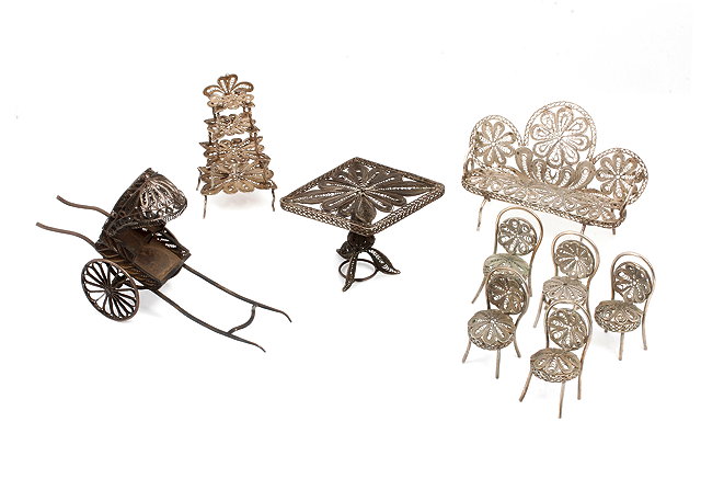 Appraisal: A COLLECTION OF SILVER FILIGREE MINIATURE DOLLS HOUSE FURNITURE to