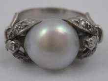 Appraisal: A white metal tests platinum diamond and pearl ring the