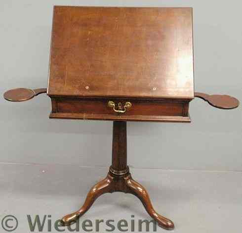 Appraisal: English mahogany writing desk c with an adjustable rectangular top