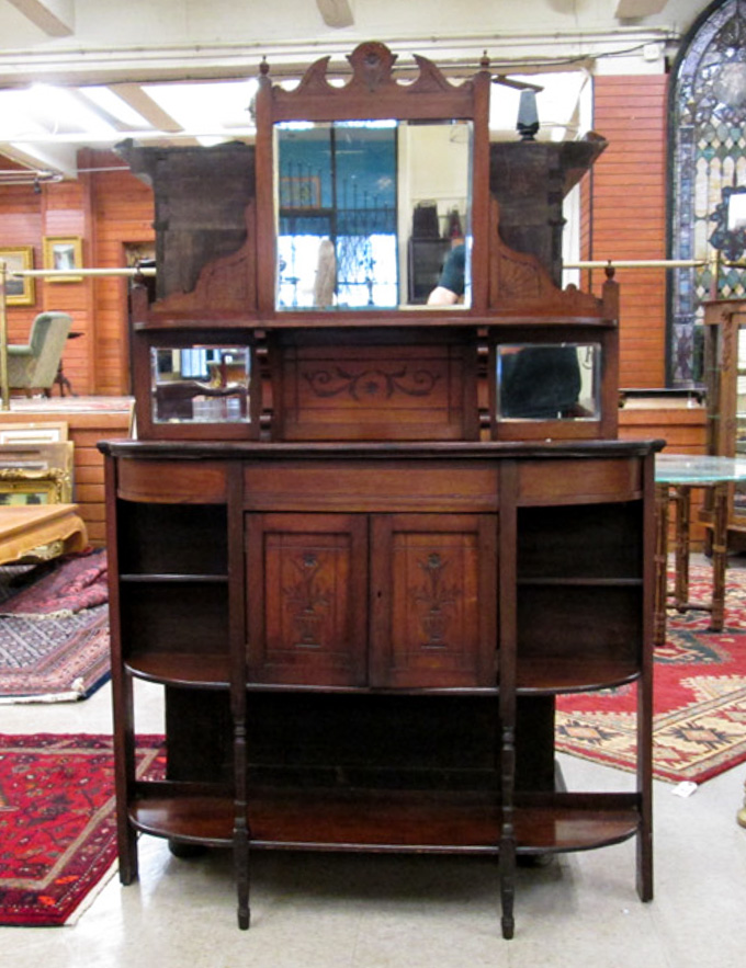 Appraisal: LATE VICTORIAN WALNUT ETAGERE English late th century a display