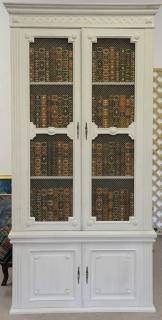 Appraisal: Two part cabinet with faux leather books behind grillwork doors