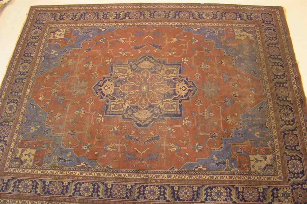 Appraisal: TURKISH HERIZ RUG brick red and blue approx ' x