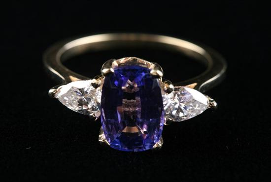 Appraisal: K YELLOW GOLD TANZANITE AND DIAMOND RING Center-mounted rectangular-shaped ct