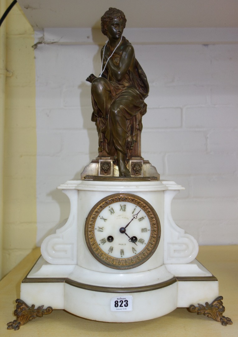 Appraisal: A Napoleon III bronze and white marble striking mantel clock