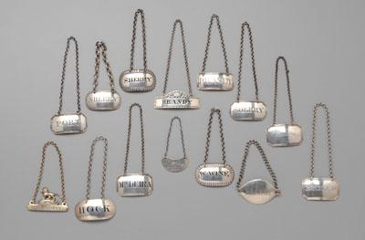 Appraisal: English silver decanter labels geometric forms reeded and gadroon borders