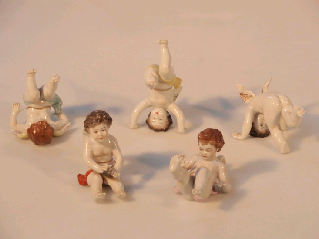 Appraisal: A group of five early thC Dresden porcelain winged cherubs