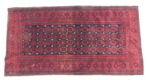 Appraisal: A Persian rug the outer field with a geometric floral