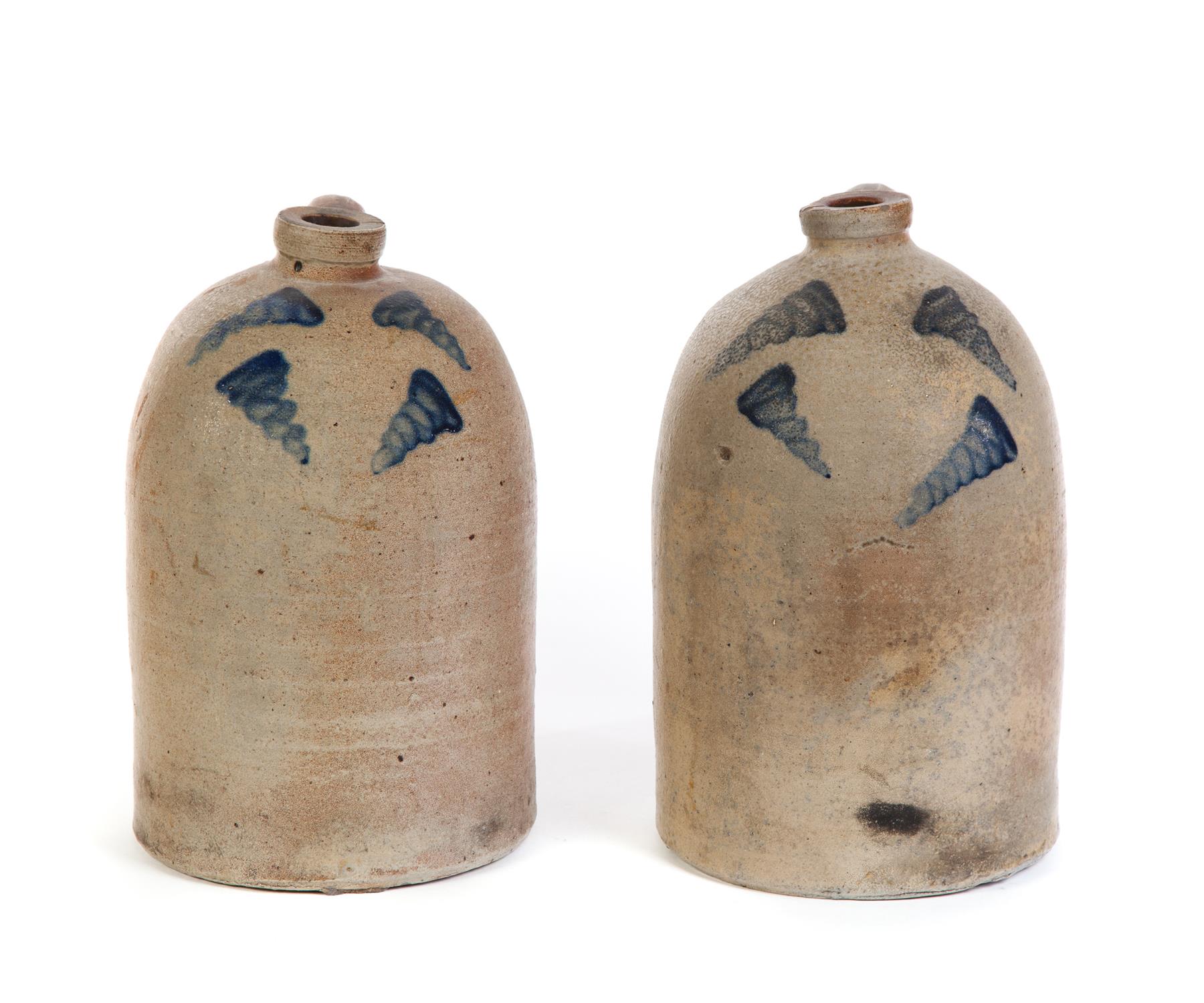 Appraisal: TWO STONEWARE JUGS WITH FREEHAND DECORATION American nd half- th