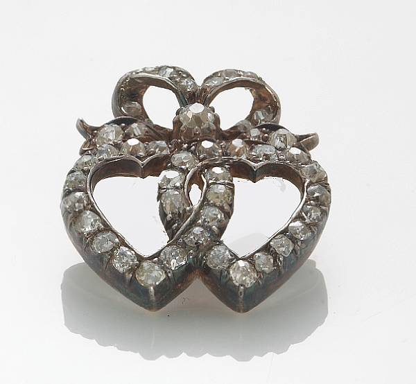 Appraisal: A diamond and silver-topped k gold double heart pendant length