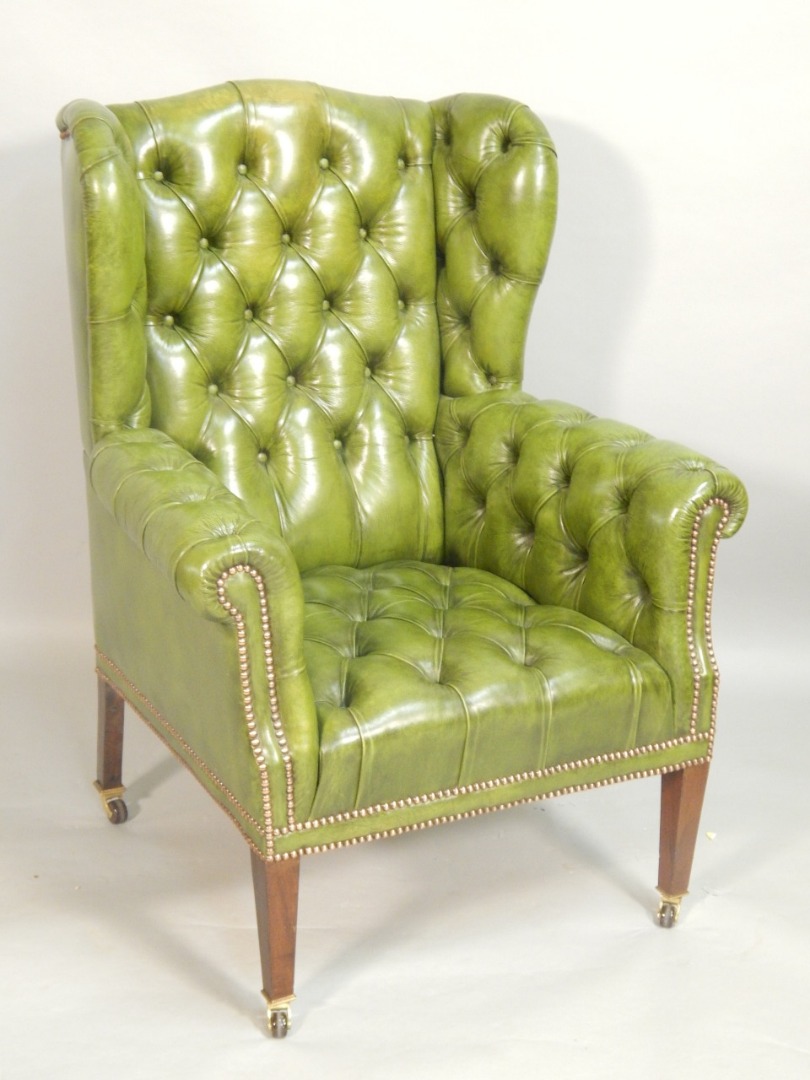 Appraisal: A late th early thC mahogany wing back armchair upholstered