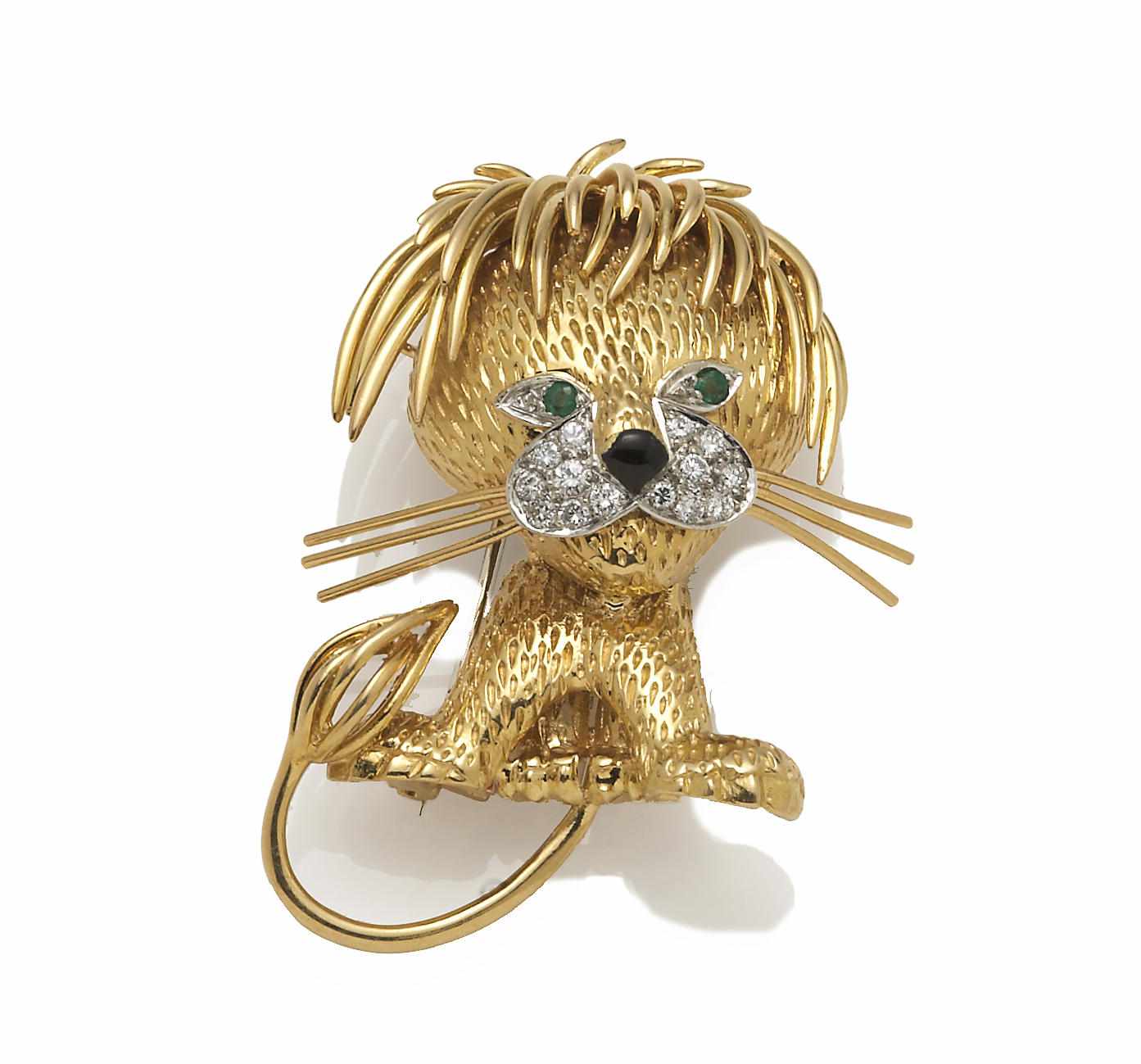 Appraisal: A diamond emerald enamel and eighteen karat gold lion brooch