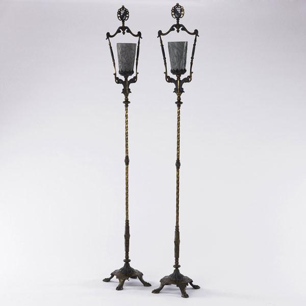 Appraisal: DECORATIVE LIGHTING Pair of wrought-iron torcheres with grasshopper design on