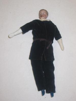 Appraisal: An unusual bisque gentleman dolls house doll the moulded head