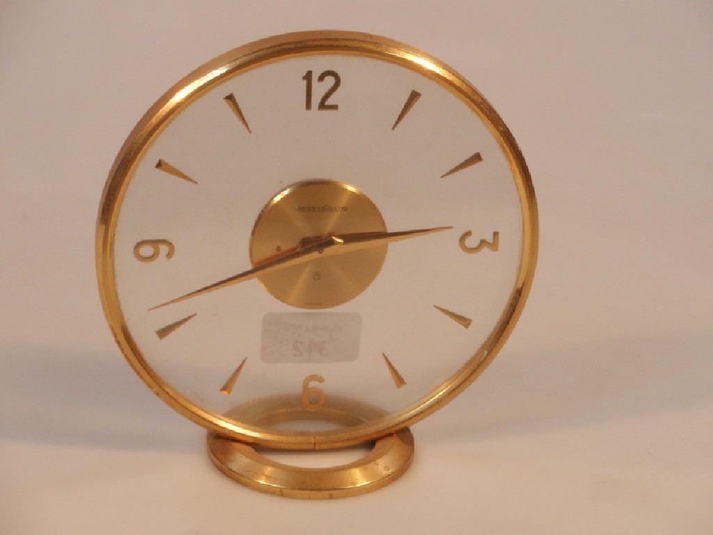 Appraisal: A Jaeger-Le-Coultre mantel clock the clear circular dial with Arabic