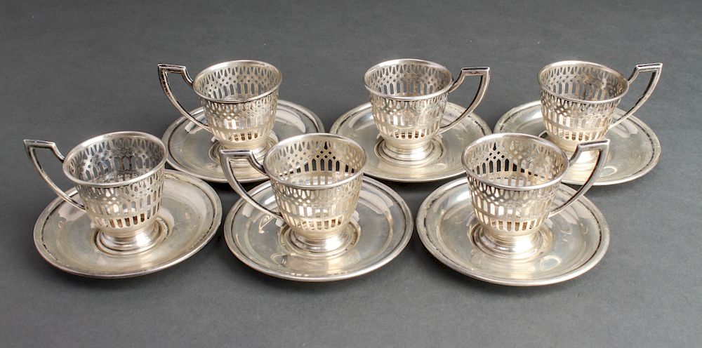 Appraisal: Silver Pierced Demitasse Cup Holders Saucers Sterling silver pierced demitasse