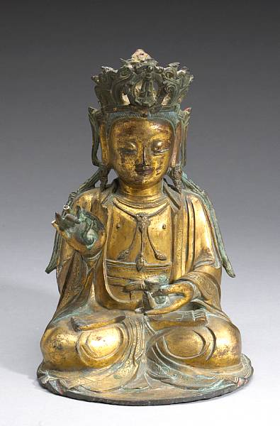 Appraisal: A gilt bronze seated figure of Guanyin Ming Dynasty Seated