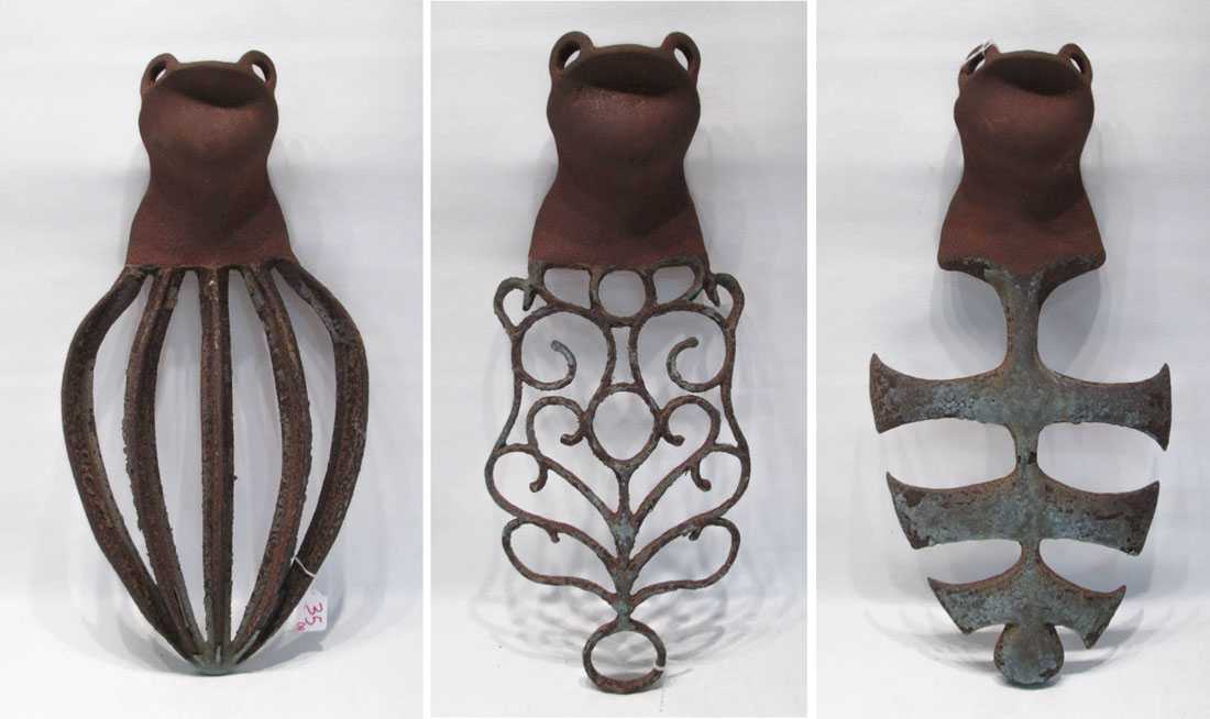 Appraisal: THREE IRON WALL SCULPTURES welded iron formed of found objects