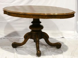 Appraisal: A Victorian walnut veneered loo table with serpentine top on