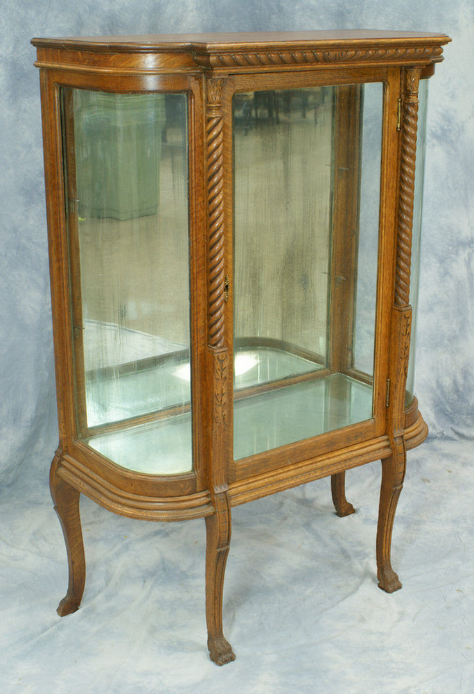 Appraisal: Oak curio cabinet with J-bend glass ends mirrored back glass