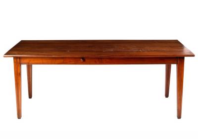 Appraisal: A French cherry wood farmhouse table the planked top on