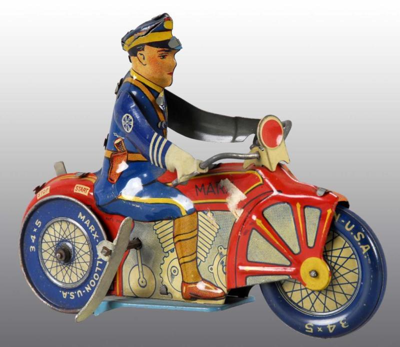 Appraisal: Tin Marx Policeman Motorcycle Wind-Up Toy Description American Working Some