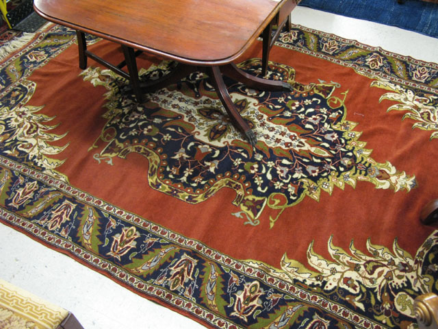 Appraisal: AN AFGHANI PERSIAN CARPET centering a large floral medallion on