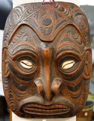 Appraisal: A large tribal mask with carved decoration and inset cowrie