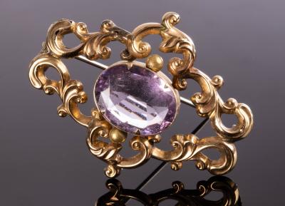 Appraisal: A Victorian brooch centred by an oval amethyst within a