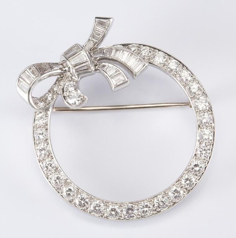 Appraisal: Platinum Diamond Bow Brooch Platinum diamond round bow knot pin