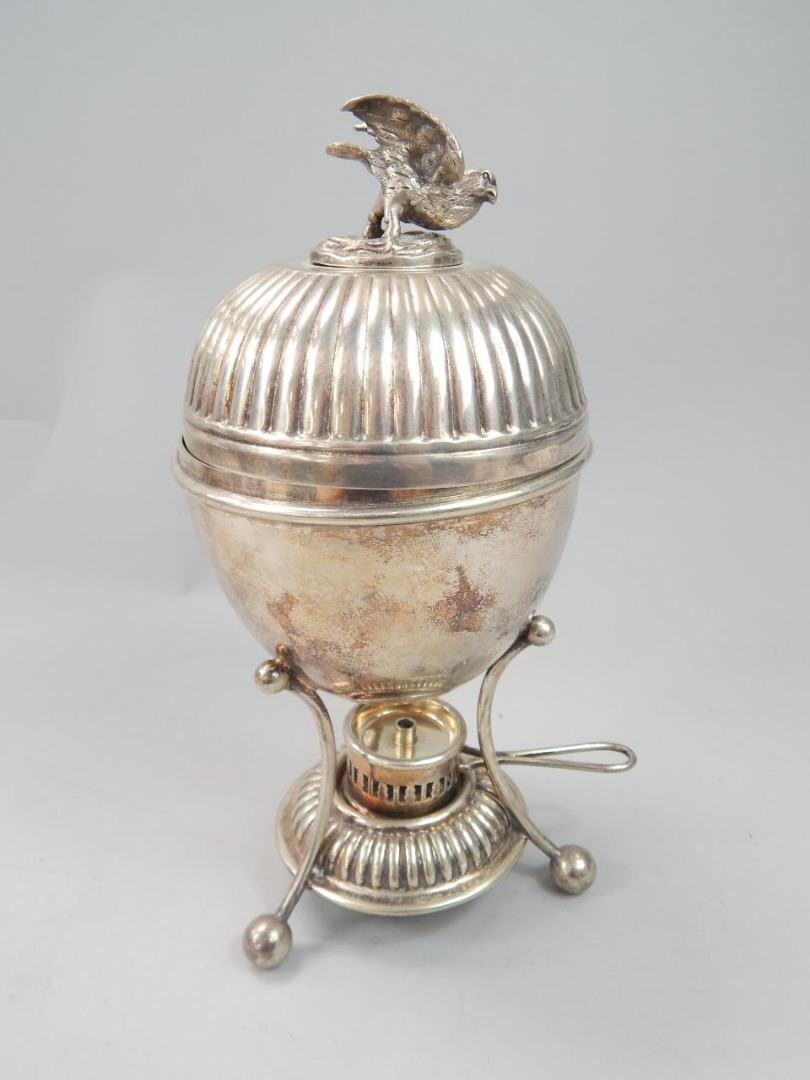 Appraisal: An Edwardian silver plated urn shaped egg warmer of typical