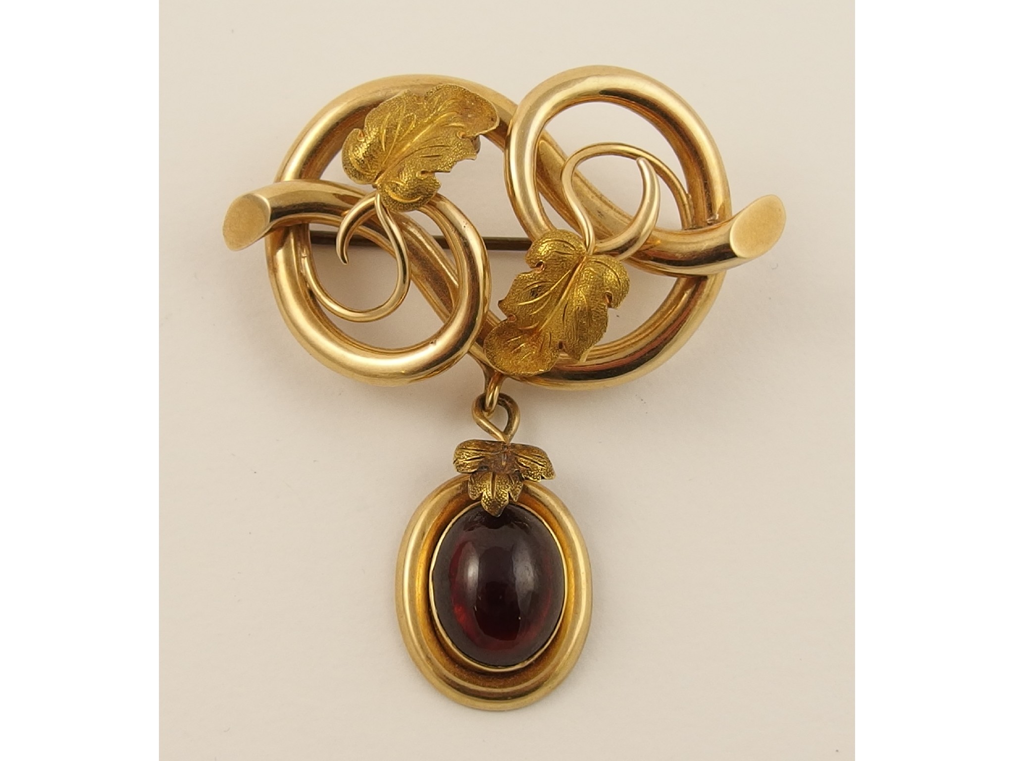 Appraisal: A late Victorian broochin the shape of a lovers knot