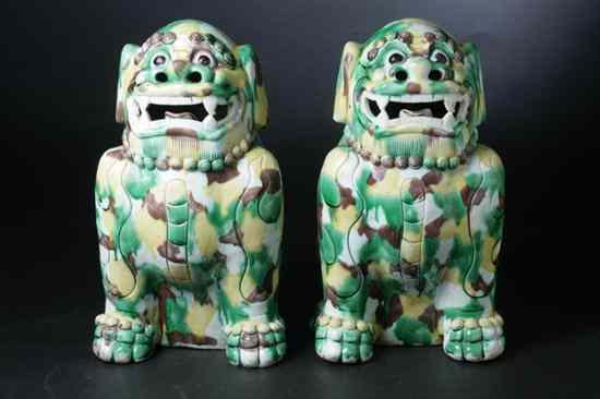 Appraisal: PAIR CHINESE EGG AND SPINACH PORCELAIN FIGURES OF FU LIONS