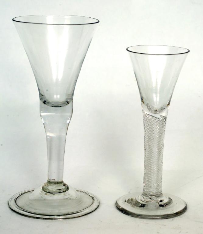 Appraisal: ENGLISH BALUSTER WINE GLASS c the funnel bowl supported on