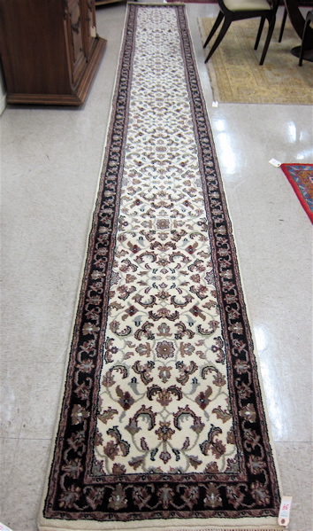 Appraisal: HAND KNOTTED ORIENTAL RUNNER Persian Kashan design overall floral pattern