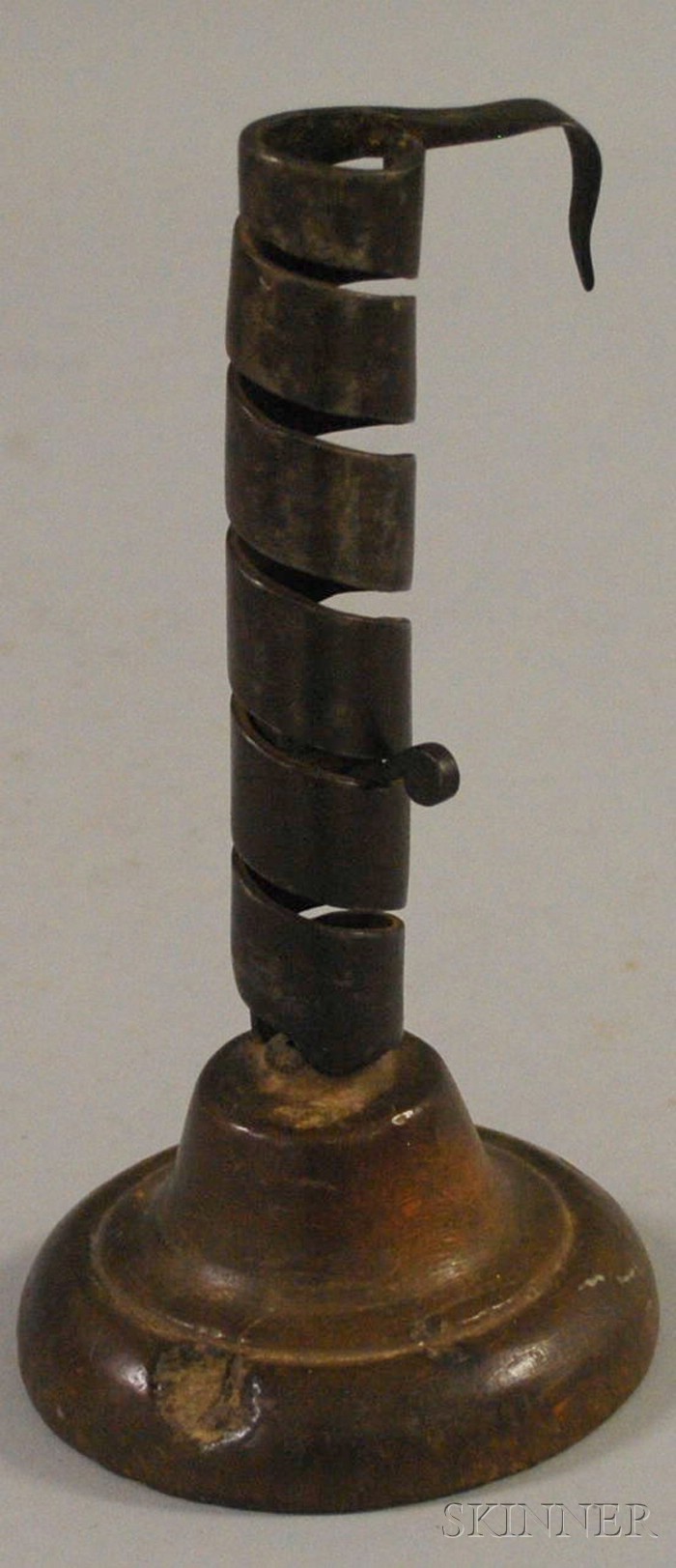 Appraisal: Wrought Iron and Wood Candlestick candle adjusts on spiral shaft