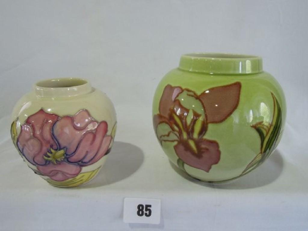 Appraisal: A Moorcroft vase with piped floral decoration on a cream