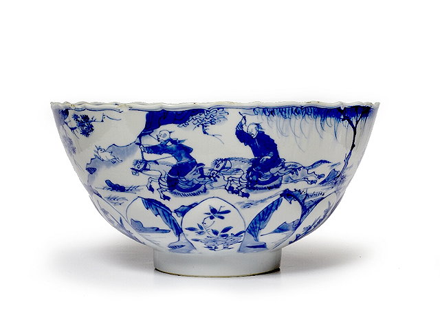 Appraisal: A Chinese blue and white bowlKangxi - moulded as a